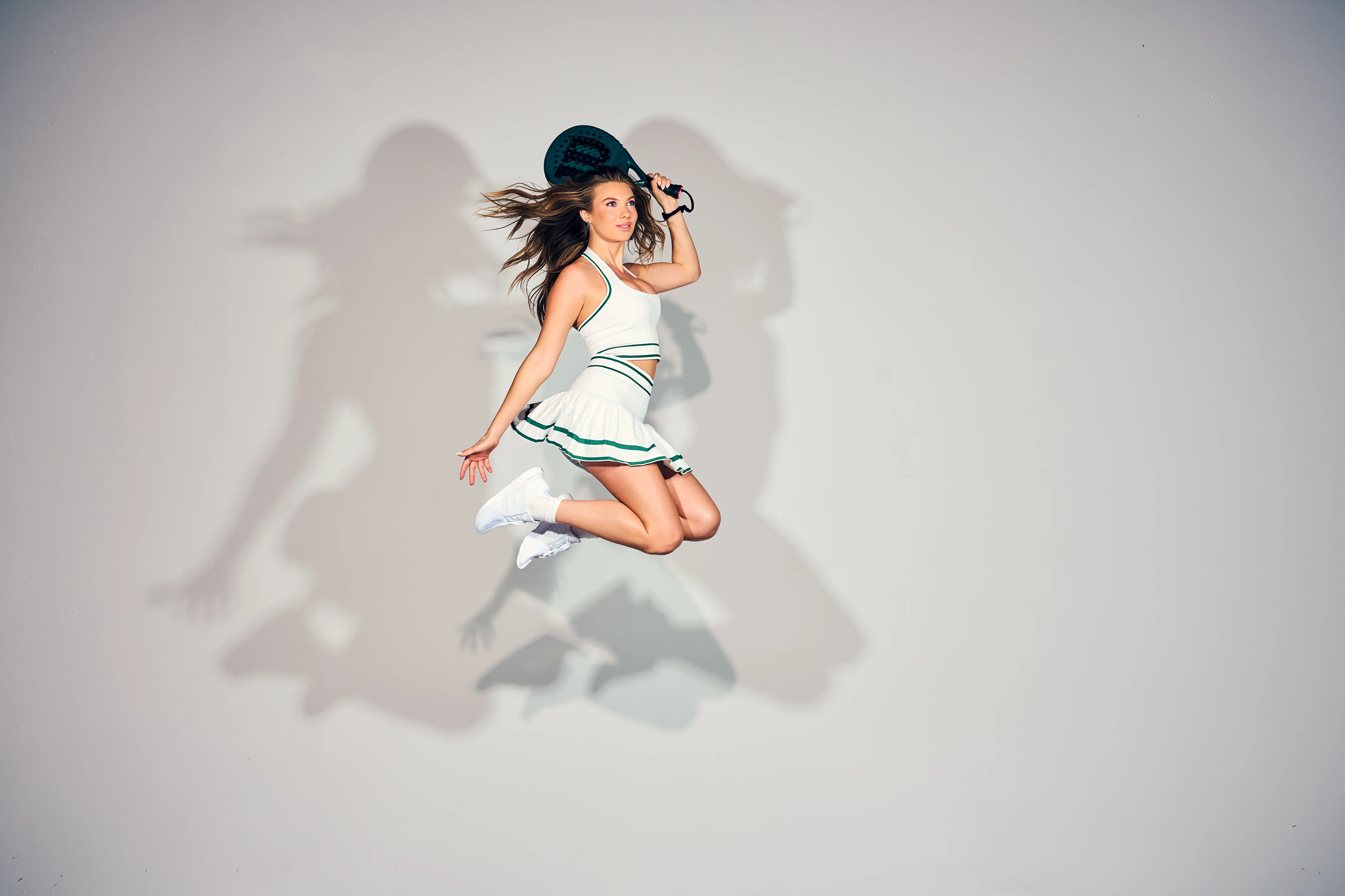 Padel athlete mid-swing